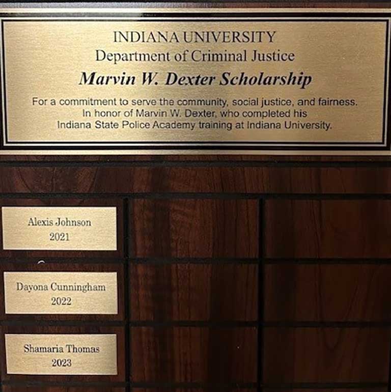 A close-up of a plaque celebrating the Marvin W. Dexter Scholarship.